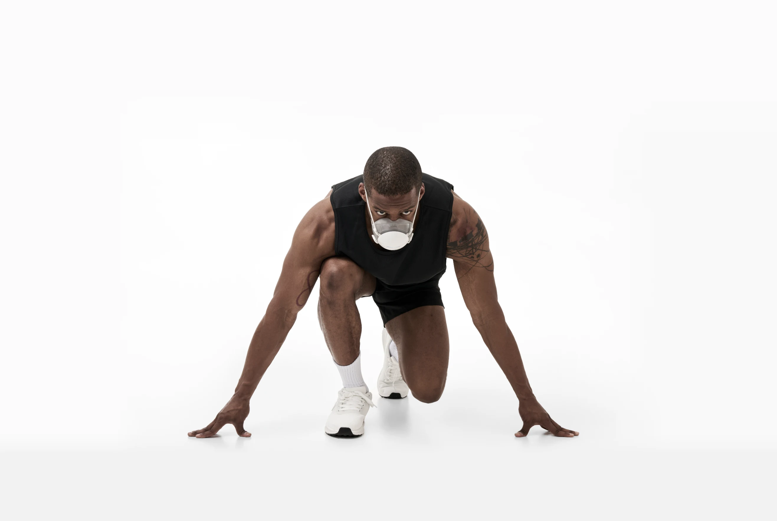 A runner wearing PACER in a ready-to-run pose