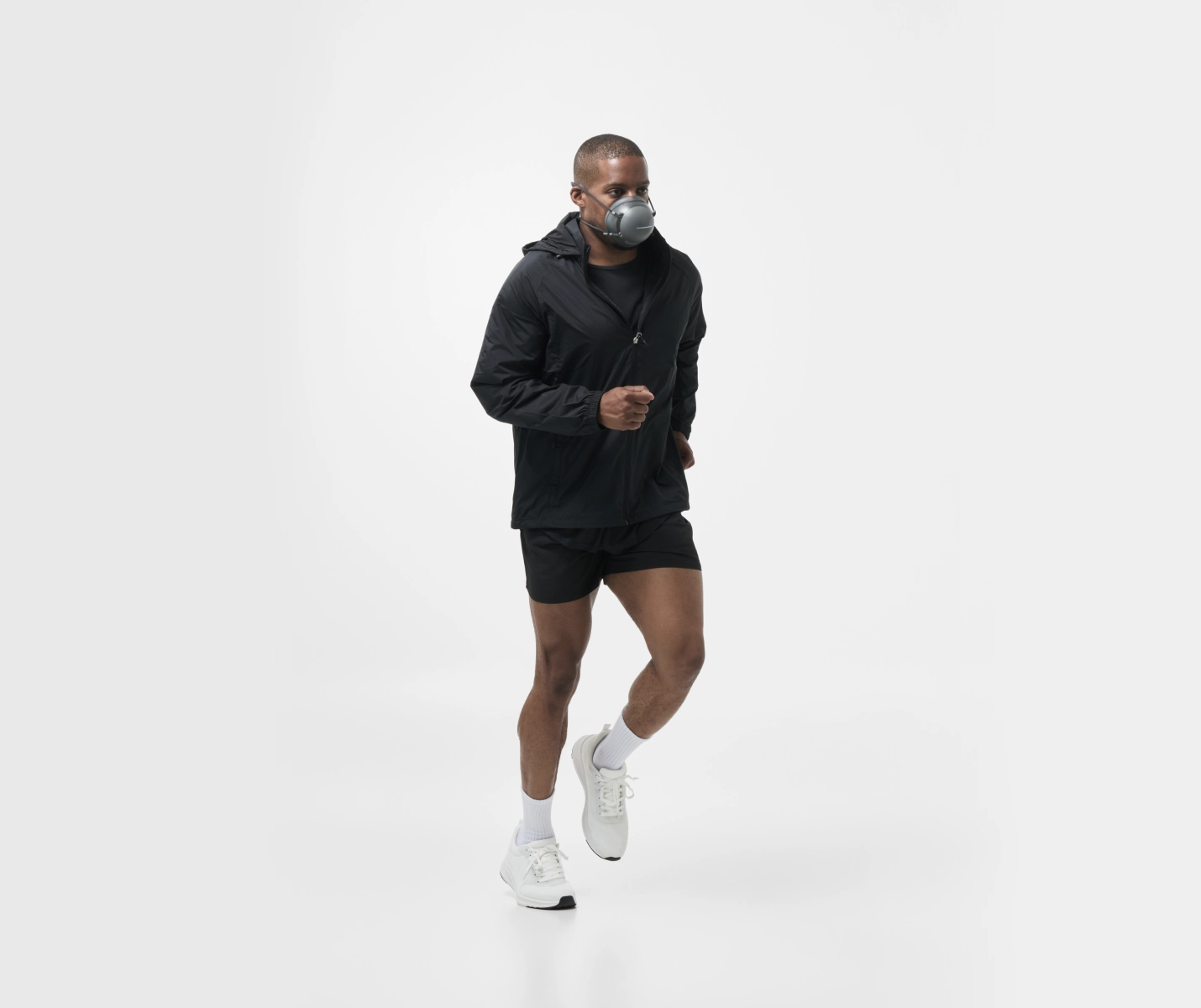 Side view of a person running lightly while wearing a PACER